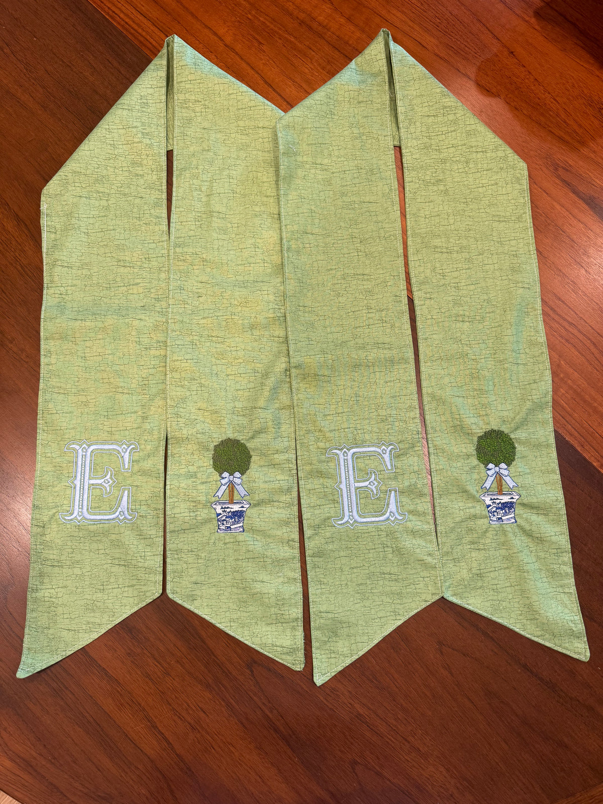 Boxwood Initial Wreath Sash on Green Fabric